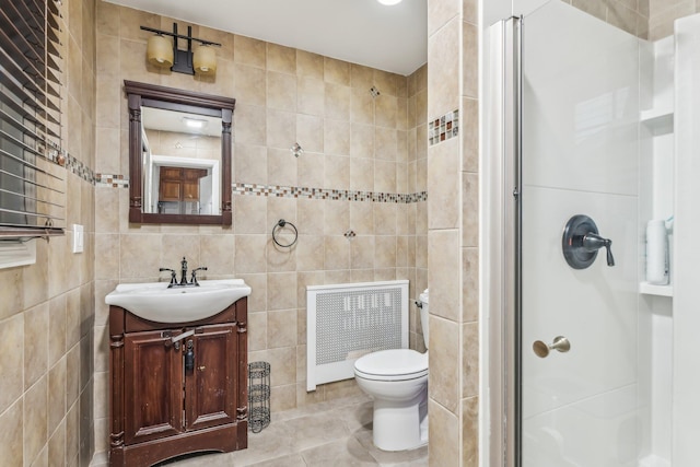 bathroom with tile walls, walk in shower, and radiator heating unit