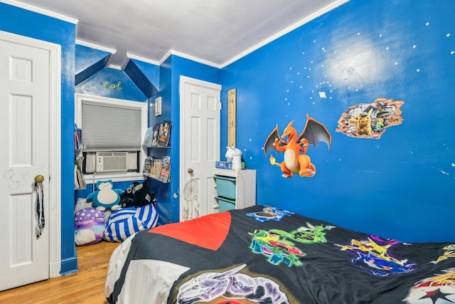 bedroom featuring wood-type flooring, crown molding, and cooling unit