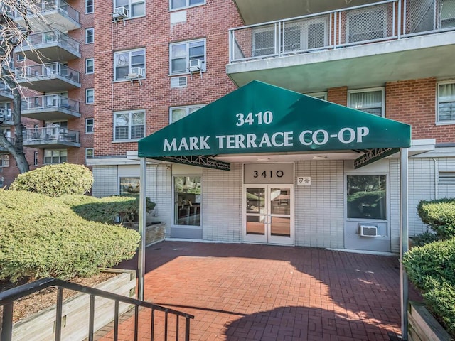 entrance to property featuring cooling unit