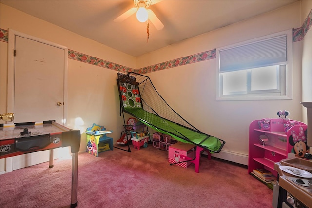 recreation room featuring ceiling fan and carpet flooring