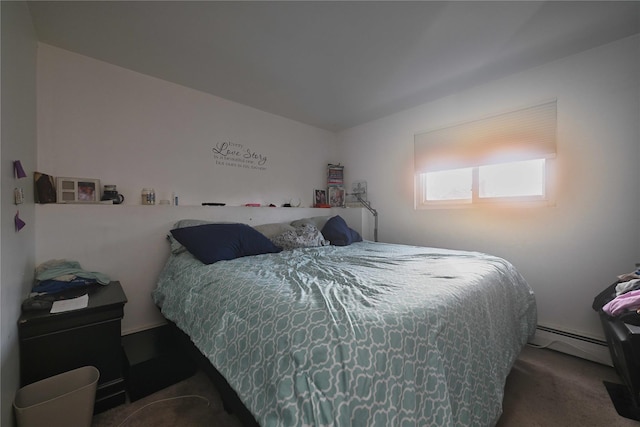 carpeted bedroom featuring a baseboard heating unit