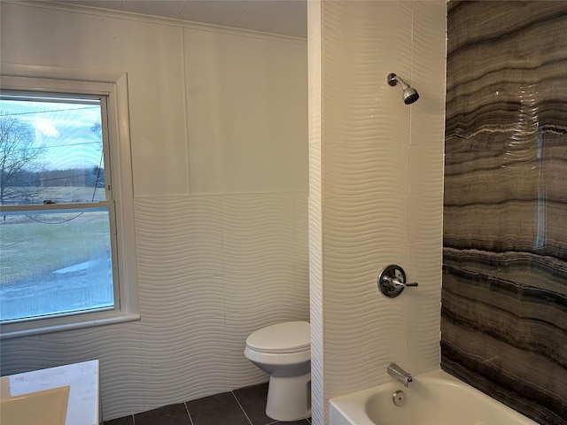 full bathroom featuring toilet, shower / bath combination, tile patterned flooring, tile walls, and vanity