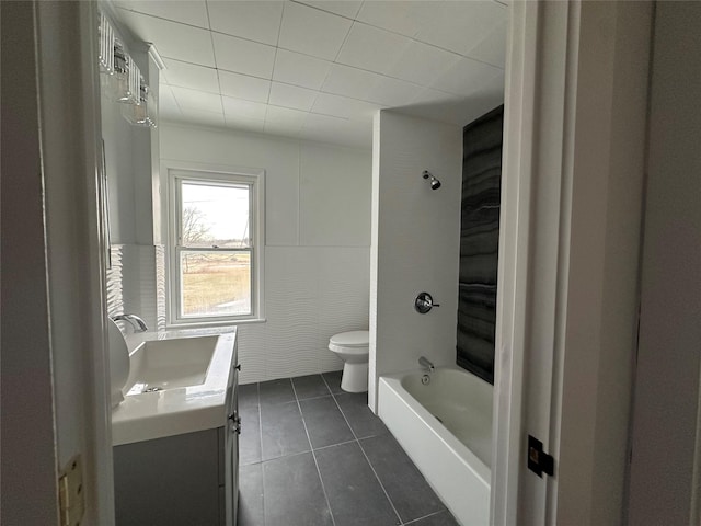 full bathroom with toilet, tile patterned flooring, shower / bath combination, and vanity