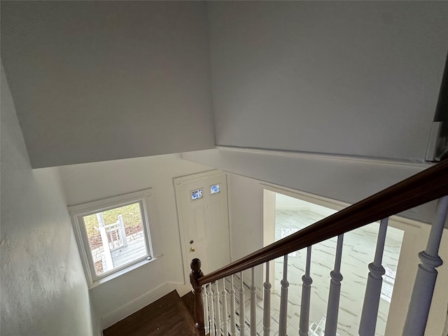 stairway with wood finished floors