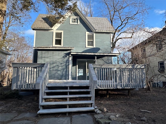 view of front of home featuring stairs and a wooden deck