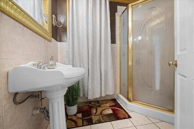 bathroom featuring tile patterned flooring and a shower with shower door