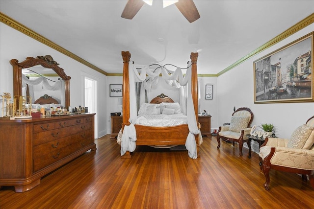 bedroom with dark hardwood / wood-style flooring, ornamental molding, and ceiling fan