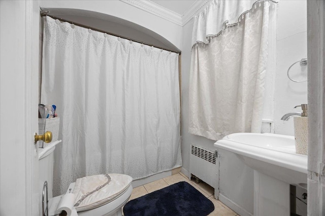 bathroom with radiator, toilet, crown molding, tile patterned floors, and a shower with shower curtain