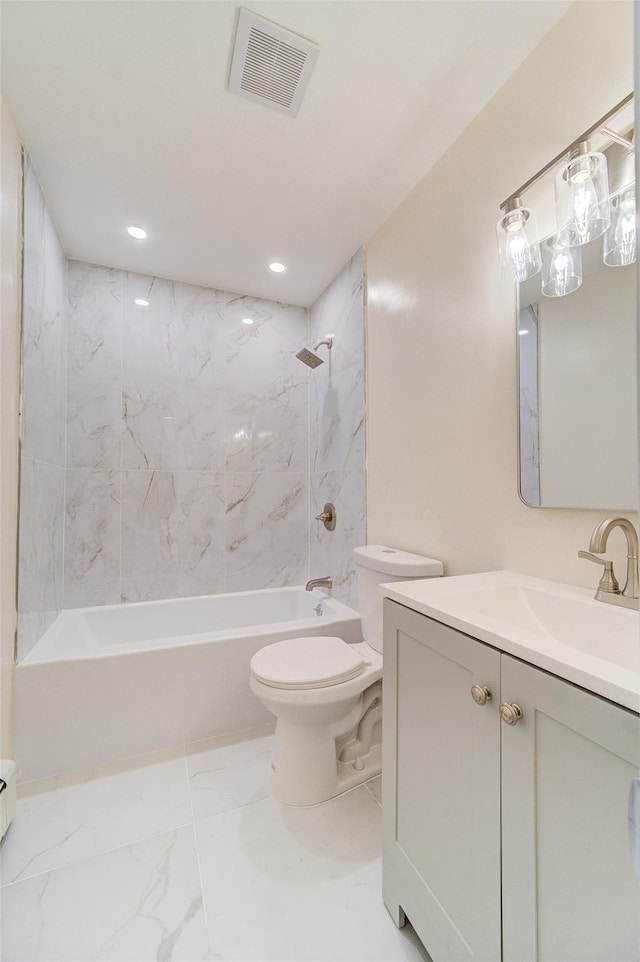 full bathroom featuring toilet, tiled shower / bath combo, and vanity