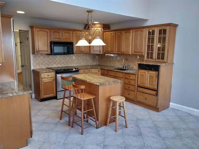 kitchen with a kitchen island, sink, stainless steel electric range oven, light stone counters, and a breakfast bar