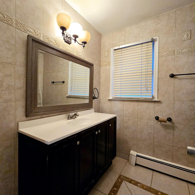 bathroom featuring baseboard heating, tile walls, tile patterned floors, and vanity