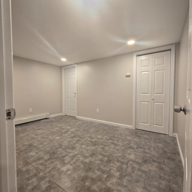 basement featuring a baseboard radiator