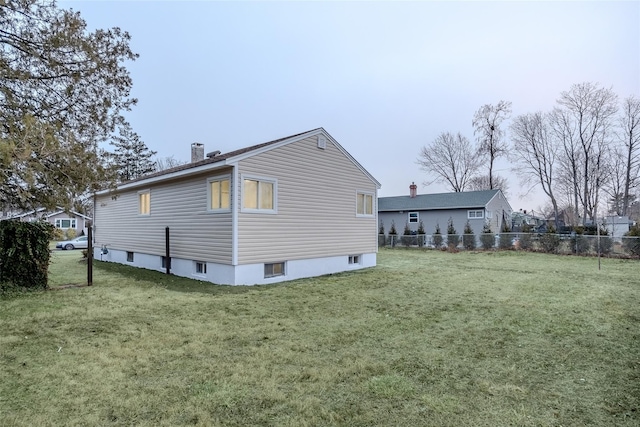 view of home's exterior featuring a yard