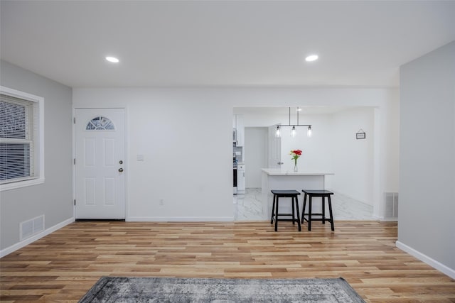 entrance foyer featuring light hardwood / wood-style floors