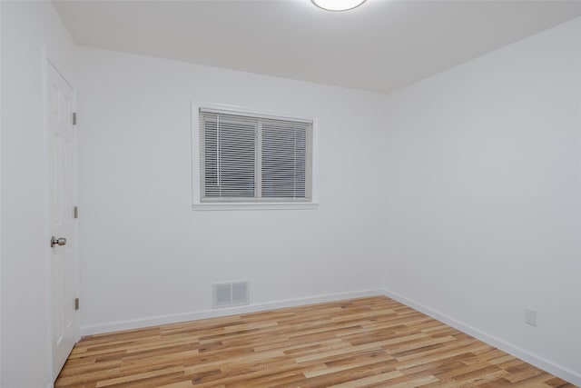 spare room with light hardwood / wood-style floors