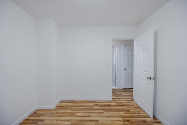 empty room with light hardwood / wood-style floors