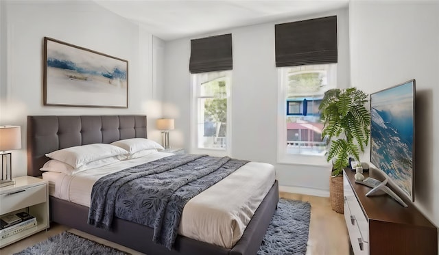 bedroom with light hardwood / wood-style floors