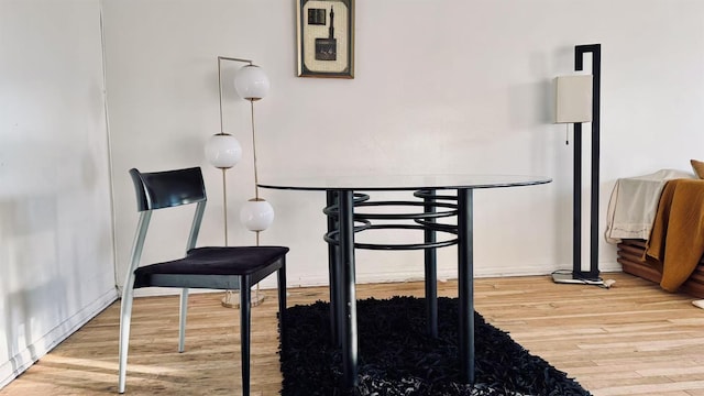 dining space featuring hardwood / wood-style flooring