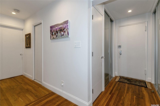 hallway featuring dark hardwood / wood-style flooring