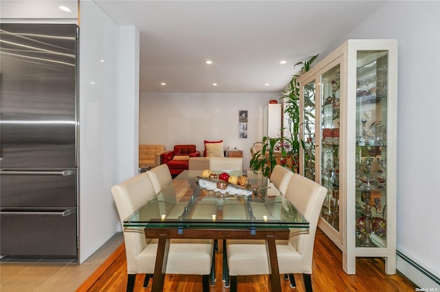 dining area with a baseboard radiator