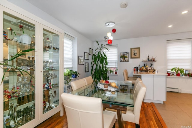 dining area featuring baseboard heating