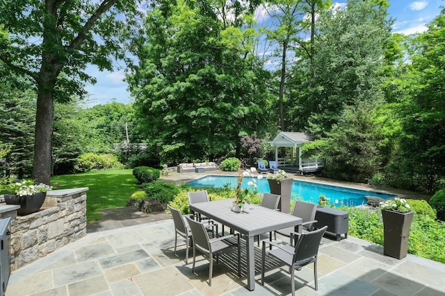 652 Long Hill Rd W, Briarcliff Manor, NY 10510 - view of patio / terrace featuring an outdoor pool, outdoor dining area, and view of scattered trees