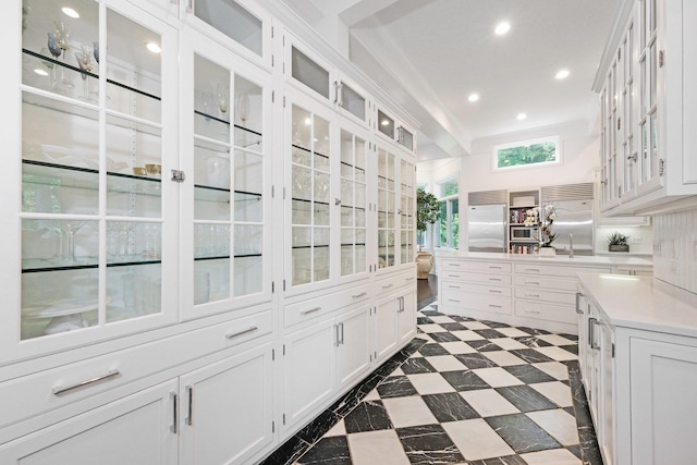 652 Long Hill Rd W, Briarcliff Manor, NY 10510 - kitchen featuring built in refrigerator, glass insert cabinets, white cabinets, light countertops, and recessed lighting