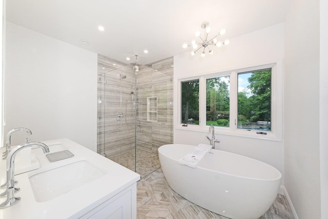652 Long Hill Rd W, Briarcliff Manor, NY 10510 - bathroom with a shower stall, a freestanding tub, a sink, a chandelier, and recessed lighting