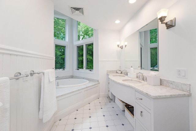 652 Long Hill Rd W, Briarcliff Manor, NY 10510 - full bathroom featuring a garden tub, double vanity, recessed lighting, and tile patterned floors