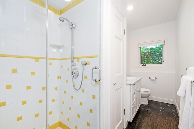 652 Long Hill Rd W, Briarcliff Manor, NY 10510 - bathroom featuring a shower stall, vanity, baseboards, wood finished floors, and toilet