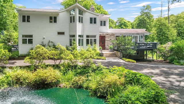652 Long Hill Rd W, Briarcliff Manor, NY 10510 - view of front of home with a chimney and a wooden deck