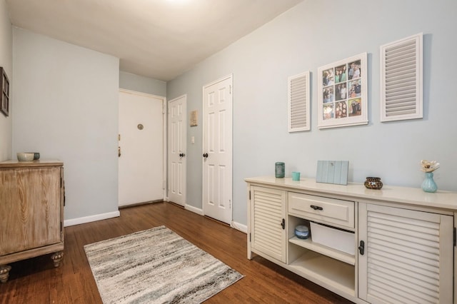 entrance foyer with dark hardwood / wood-style flooring