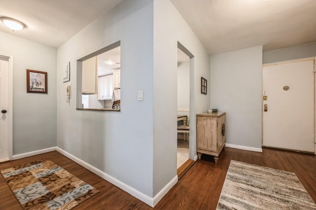 hall with dark wood-type flooring