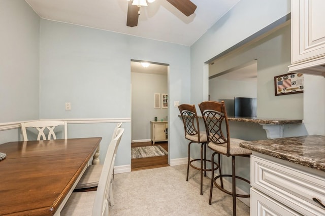 dining space featuring ceiling fan