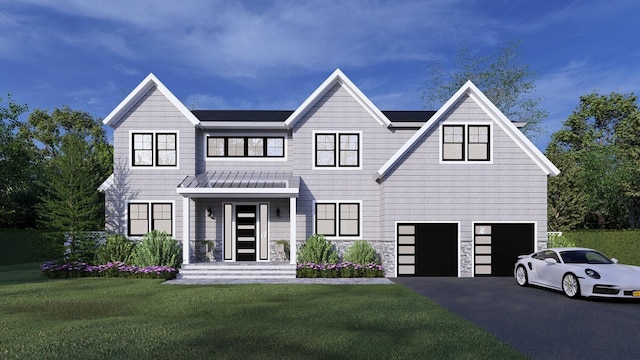 view of front facade with a front yard and a garage