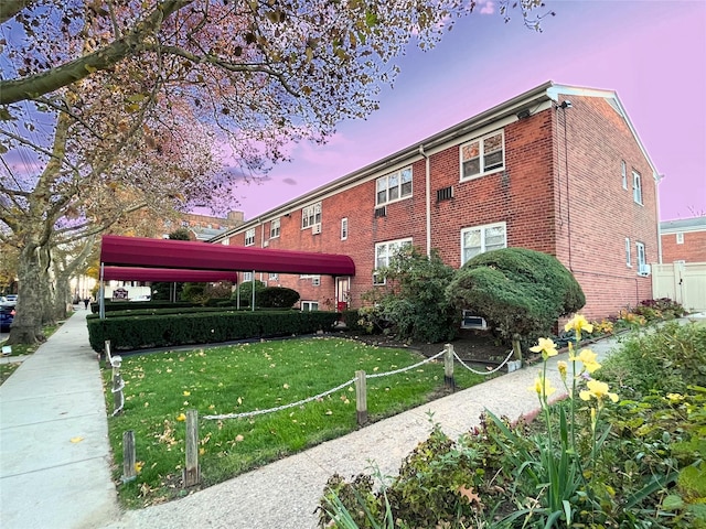 view of outdoor building at dusk