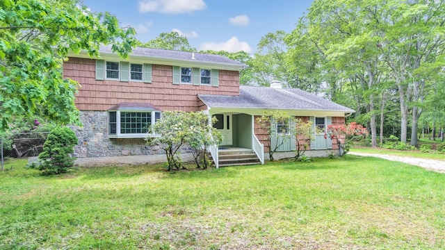 47A Old Squires Rd, Hampton Bays, NY 11946 - view of front of house featuring a front yard and a shingled roof
