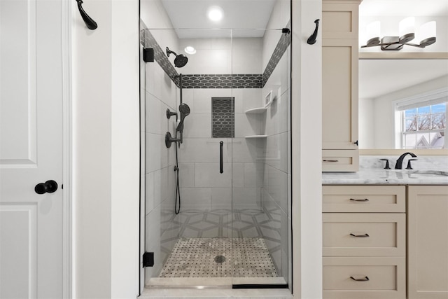 bathroom featuring an enclosed shower and vanity