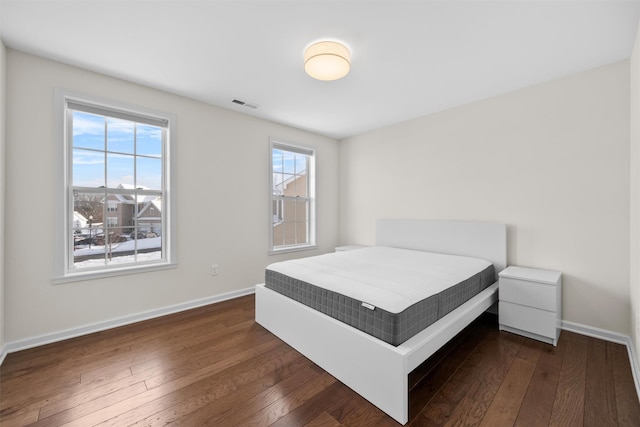 bedroom featuring dark hardwood / wood-style flooring