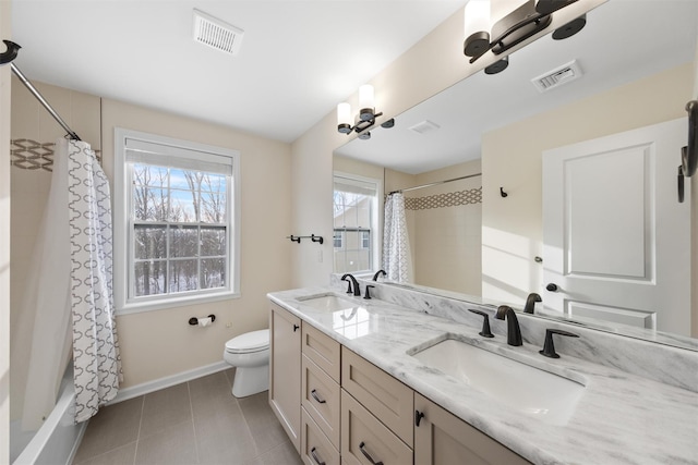 full bathroom with toilet, vanity, tile patterned floors, and shower / bath combo with shower curtain