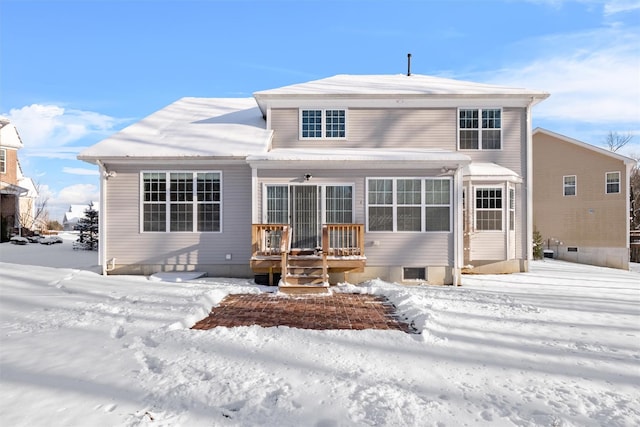 view of snow covered house