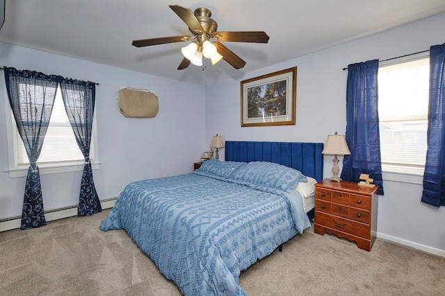 bedroom featuring multiple windows, ceiling fan, and light carpet