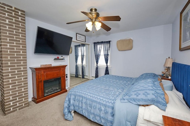 bedroom featuring light colored carpet and ceiling fan