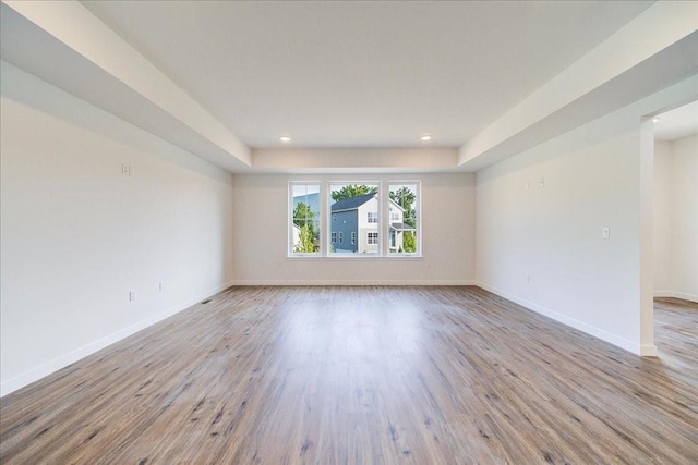 spare room featuring light hardwood / wood-style flooring