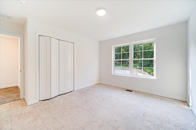 unfurnished bedroom with a closet