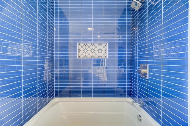 bathroom featuring washtub / shower combination