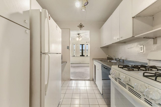 kitchen featuring sink, white appliances, ceiling fan, white cabinetry, and light carpet