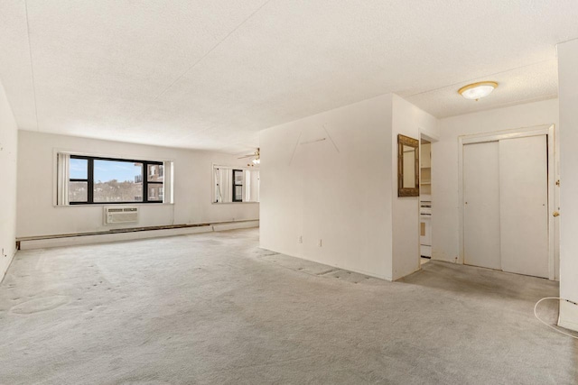 interior space with a baseboard heating unit and ceiling fan