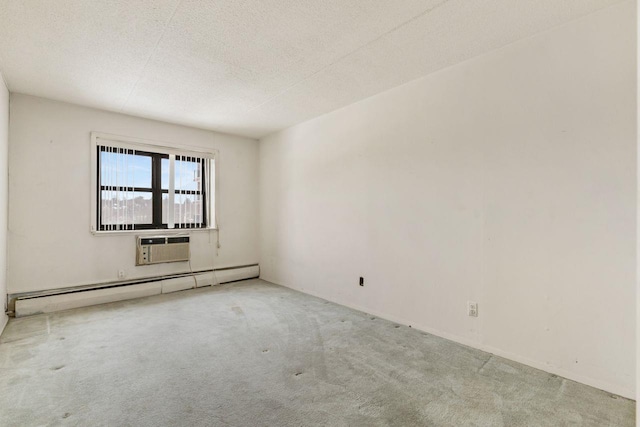 carpeted empty room featuring baseboard heating, a wall mounted AC, and a textured ceiling