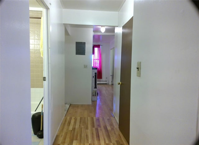 hallway with baseboard heating, electric panel, and light hardwood / wood-style flooring